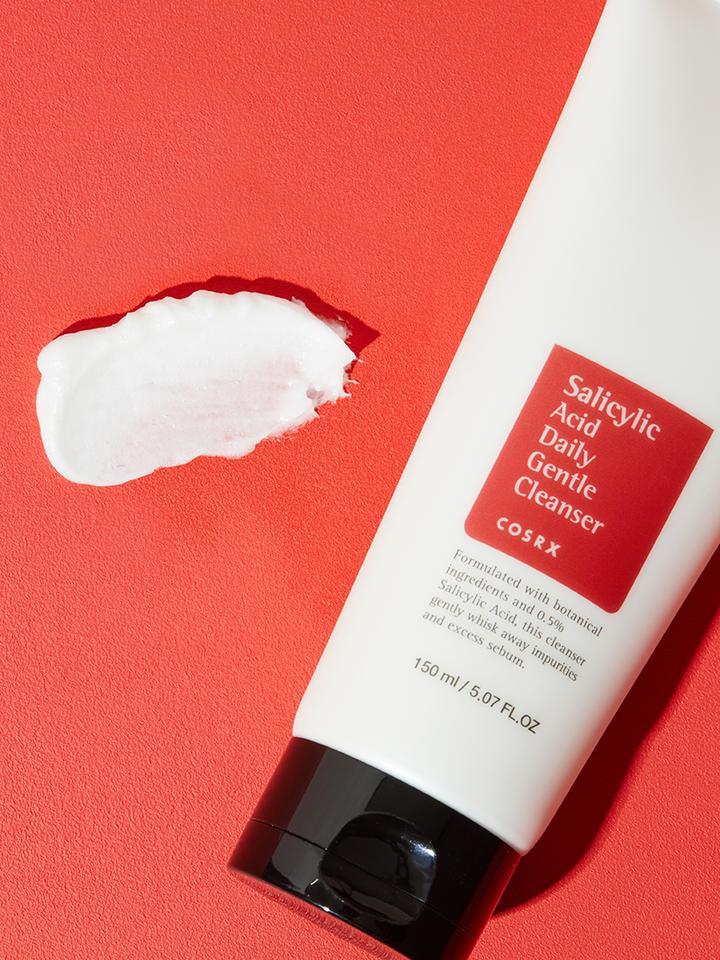 Image of COSRX Salicylic Acid Daily Gentle Cleanser, a Korean skincare product that is gentle, non-drying, and non-irritating. This cleanser is formulated with salicylic acid and tea tree oil to help control oil production and exfoliate the skin, making it perfect for acne-prone skin